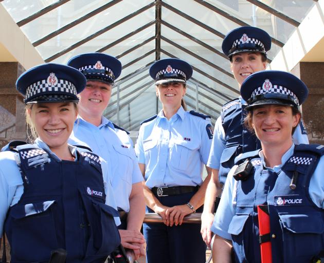 Dunedin policewomen (from left) Constable Shelley Phair, Senior Sergeant Becky Hill, Inspector Amelia Steel, Constable Charlotte Barnes and Constable Kylie Batten look forward to welcoming more women to the local force. PHOTO: EMMA PERRY