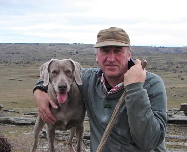 Strath Taieri Community Board member-elect Robin Thomas and his dog Anna on his property,‘...