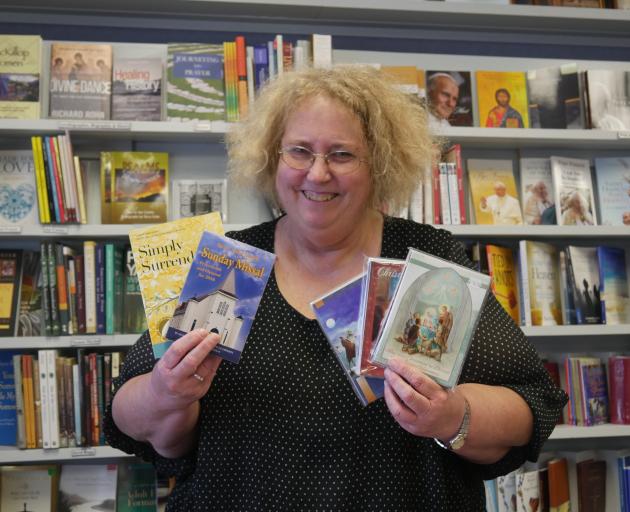 Full of Grace shop manager Sheryl Smith displays some of the items available for purchase during the shop’s closing down sale. PHOTO: JESSICA WILSON