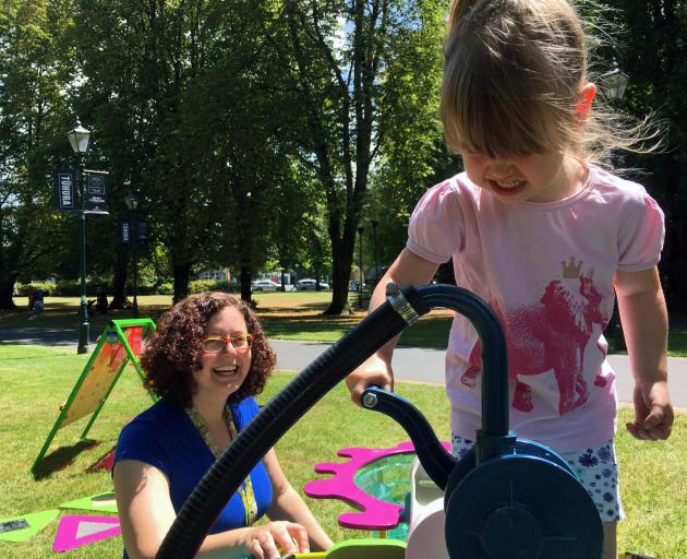 Otago Museum science engagement co-ordinator Nathalie Wierdak watches Nancy Hutchinson (3) test...