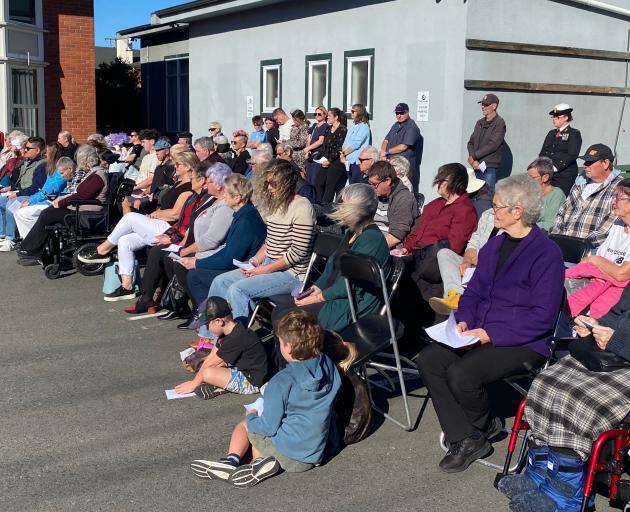 A section of the crowd of about 400 who attended the Anzac Day service on a warm, sunny, but...