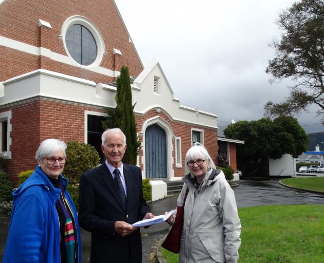 Maori Hill residents Gillian Fleming (left) and Barbara Frame (right) hand over a petition...