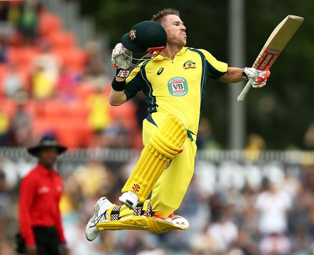 Australia's David Warner celebrates reaching his century. Photo Getty
