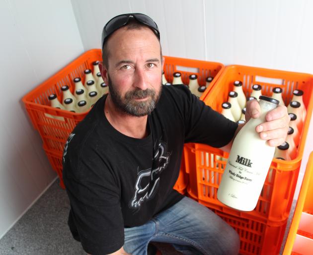 Dairy farmer Andrew Moir has started selling pasteurised full-cream milk in the Clutha District, just like it was in the \"good old days''. Photo by Samuel White.