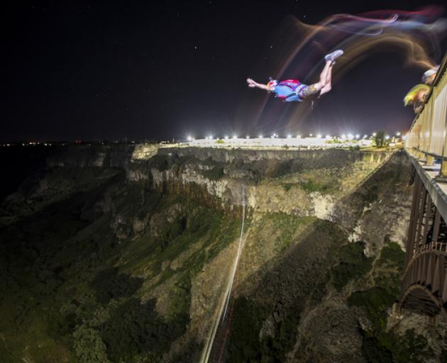 Miles Daisher BASE jumps for 24 hours and sets world record with 63 jumps in Twin Falls, Idaho, USA. Photo: Reuters