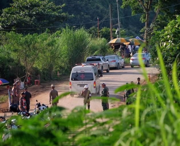 An ambulance transports the fifth boy rescued from Tham Luang Nang Non cave to hospital on July 9...