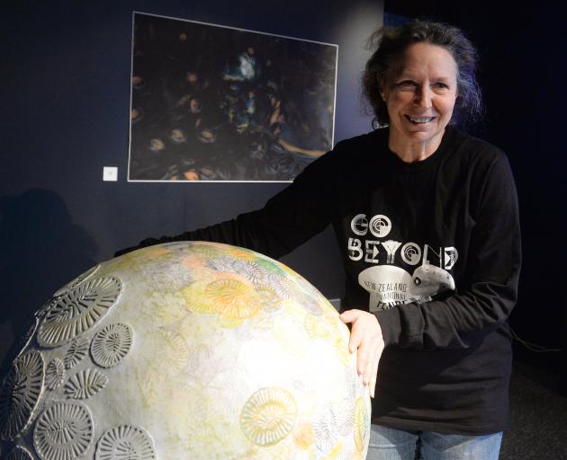 ‘‘Art + Oceans’’ exhibition co-curator Pam McKinlay at the Otago Museum with a sculpture of a...