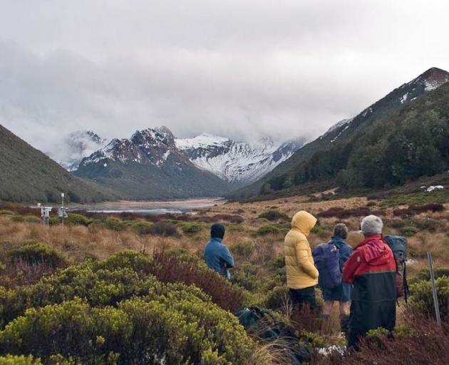 Members of the Fiordland Tramping and Outdoor Recreation Club at the Takahe Valley with Lake...