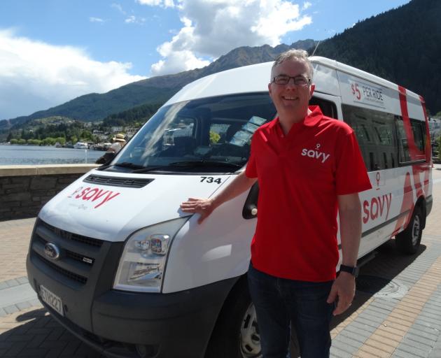 Go Bus director Russell Turnbull with a Savy ride-share minibus in Queenstown last November....