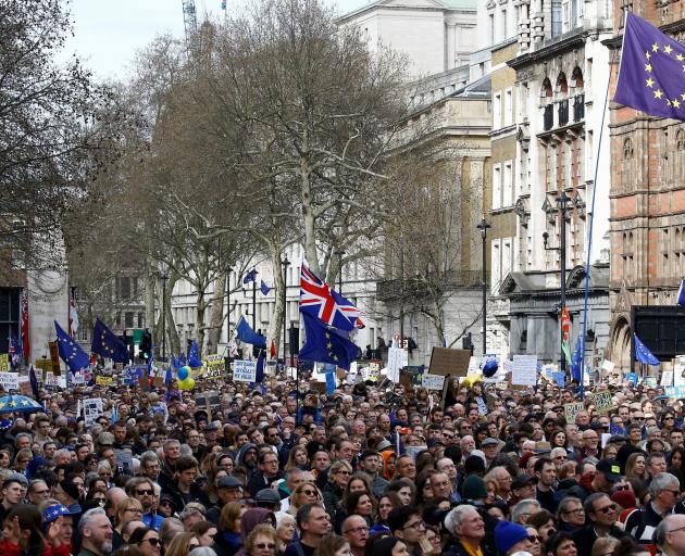 EU supporters, calling on the government to give Britons a vote on the final Brexit deal,...