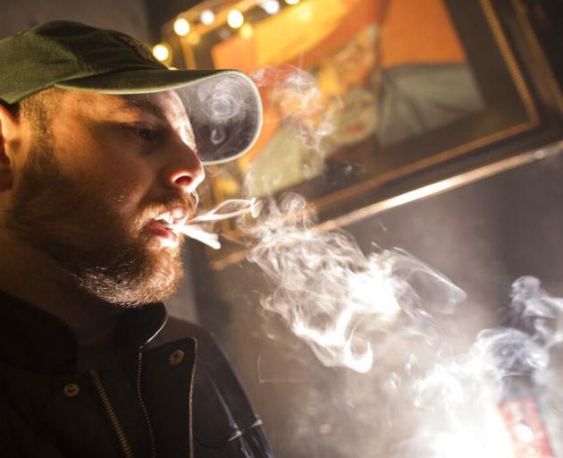 A man smokes marijuana at a Spleef NYC canna-cocktail party in New York. Photo: AP