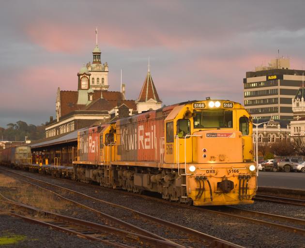 A train hauling wagons filled with coal from the Takatimu mine, in Southland, passes through...