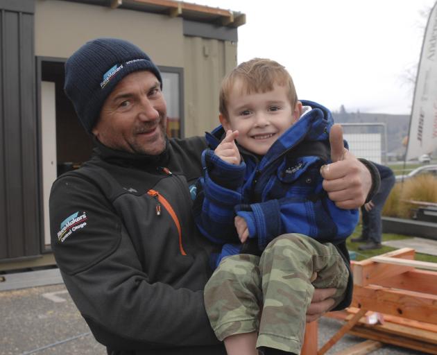 Cromwell builder Derek Craig and Harry Finch (4) give their approval to the building work in...