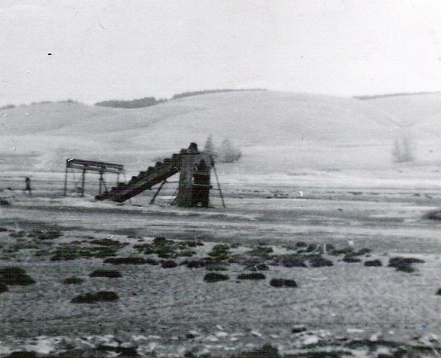 The old goldmining dredge, photographed in 1957, after the town had been flooded.