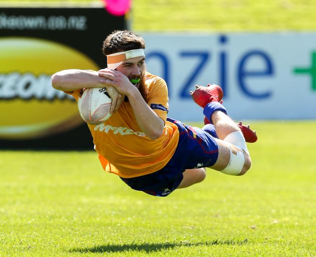 Adam Johnson of North Otago crosses the line for a try during the Meads Cup final in Oamaru....