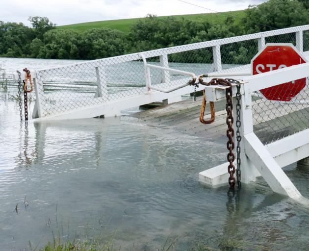 The Tuapeka Mouth punt on-ramp has been closed after being partly submerged under the rising Clutha River. Photo: Jack Conroy