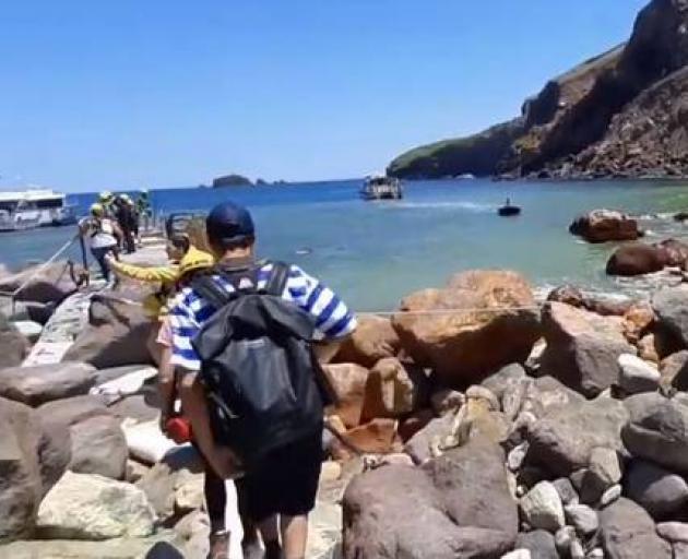 Tourists and guides ready to depart the island prior to the explosion. Photo: via YouTube