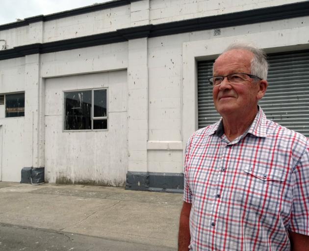 Former Oamaru borough councillor and deputy mayor Dr Ron Sim, outside a Coquet St building and...