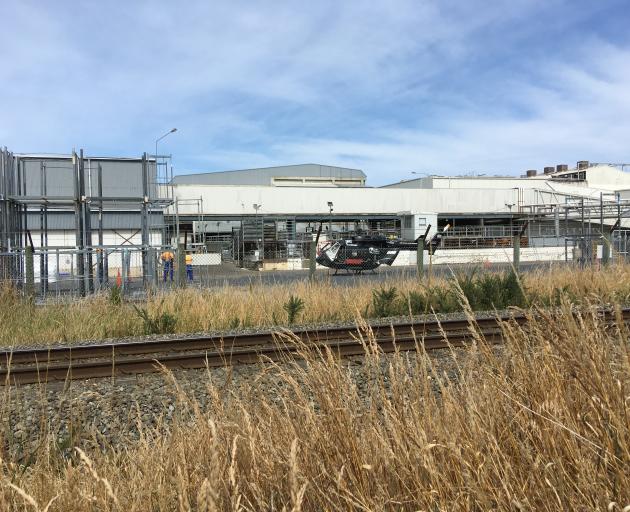 A helicopter at the Alliance Group plant at Pukeuri. Photo: Daniel Birchfield