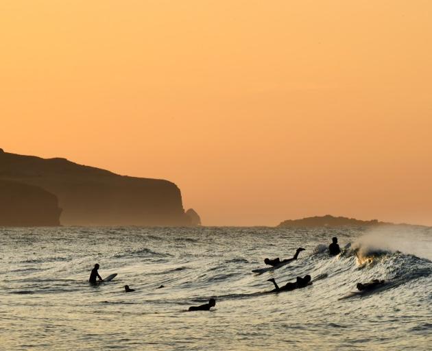 It’s been a while ... Surfers were in the water at St Clair before sunrise yesterday. PHOTO:...