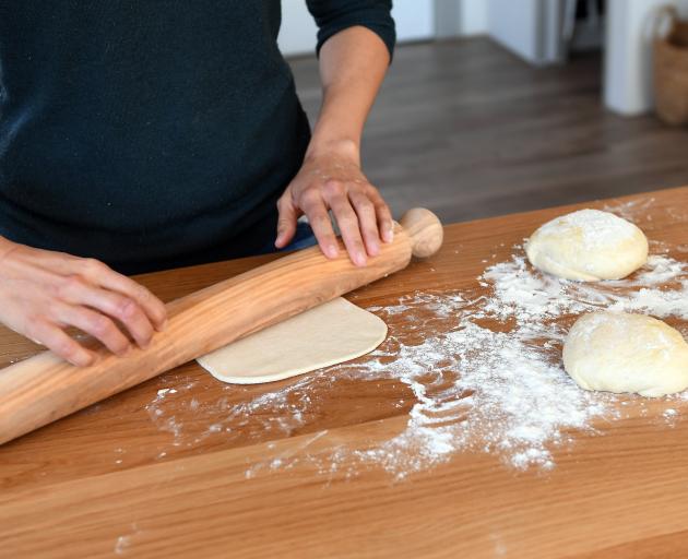 Making pizza to photograph for her Comfort Kitchen Cookbook.