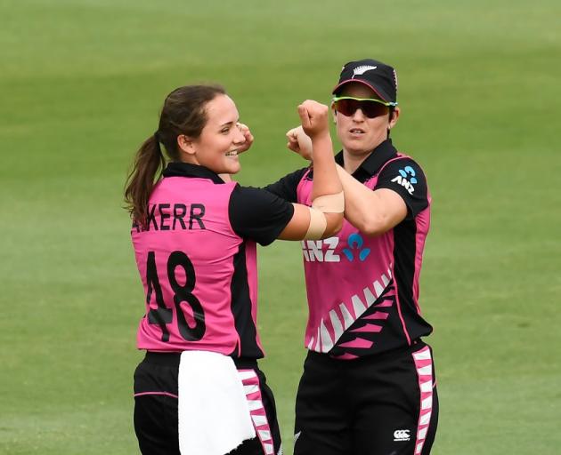 Amelia Kerr celebrates a wicket with Holly Huddleston during the White Ferns win over Australia...