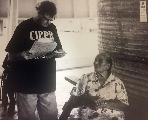 John Veale assessing the vision of an inhabitant on Palmerston Island, a tiny coral atoll in the...