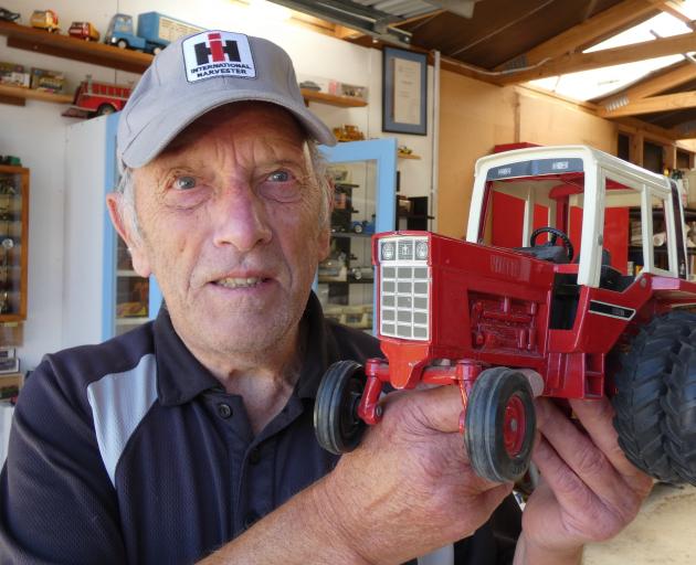 Ross Hansen, who spent his earlier years working as an apprentice for International Harvester Company, now collects toy vehicles including some of the brand’s tractors. Some of the cars he has collected do not get a paint job (left). PHOTO: ALEXIA JOHNSTO