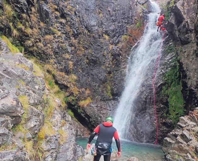 A police dive team completes a search of the upper waterfalls at the Rolleston River, near Otira....