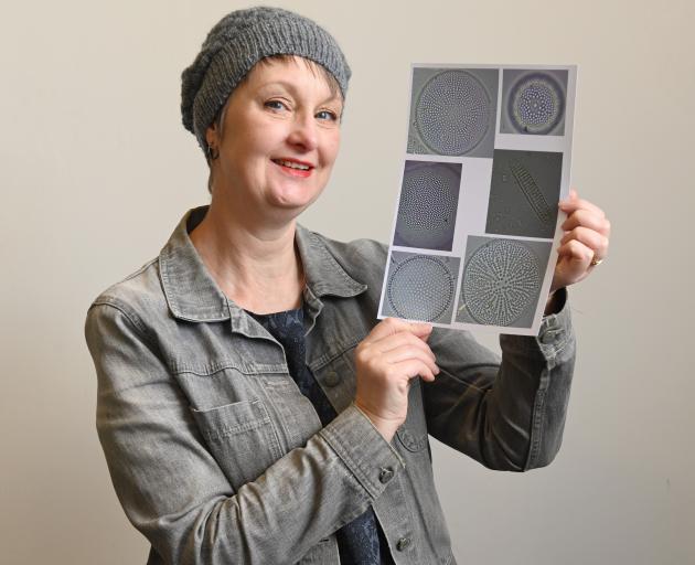 Stella Lange models the hat she designed for the Earth + Science  Project — ‘‘Earth: Caught in...