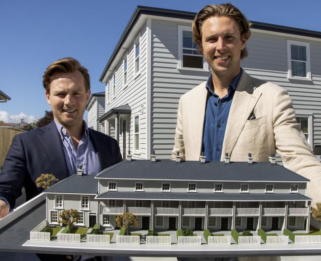 Oliver Hickman (left) and Vincent Holloway with a model of the Victorian-style townhouse...