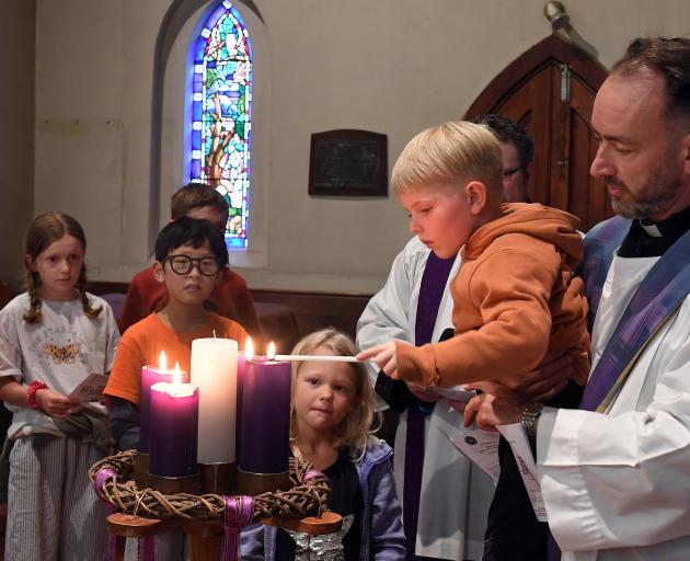 Celebrating Christmas is Malo Strong (5) at the All Saints’ Anglican Church Dunedin North service...