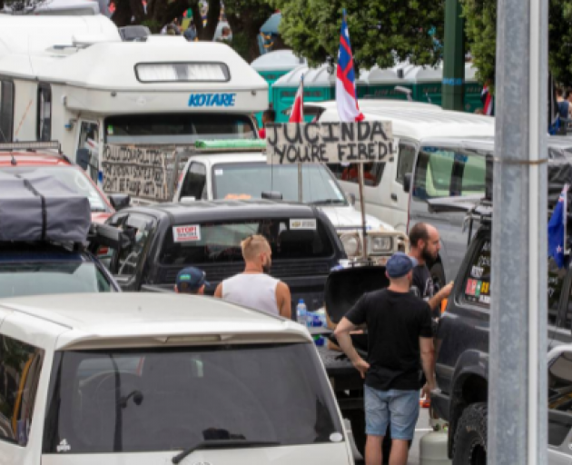 Cars from the convoy parked near Parliament. Parking wardens with police escorts began ticketing...