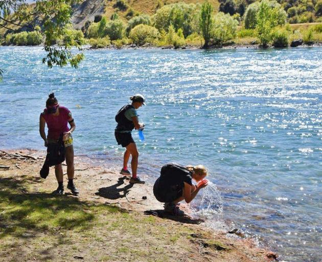 Competitors cool off in the Clutha River near Albert Town.