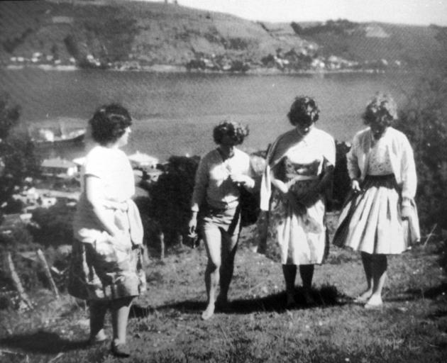 Taken in 1961, this photograph shows a group of young women on their way to Gerry’s Rock, in...