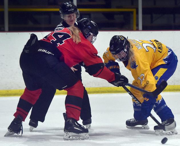 Wakatipu Wild forward Kellye Nelson (right) fights for the puck with Canterbury Inferno forward...