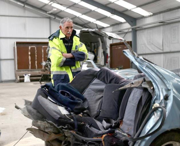 Aoraki Area Commander Inspector Dave Gaskin looks over the wreckage of a car which snapped in...