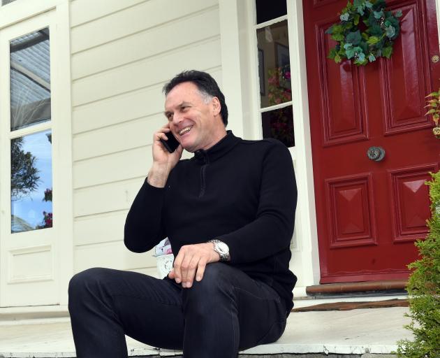 An elated Mayor elect Jules Radich on the phone after winning the Dunedin mayoralty race. Photo:...