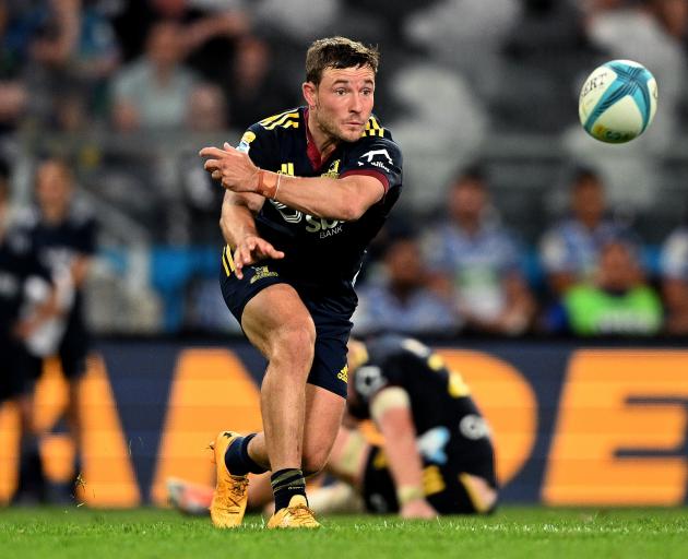 Returning Highlander Mitch Hunt passes for his side in its Super Rugby Pacific round one match...