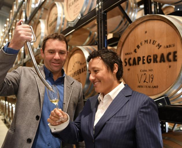 Scapegrace Distilling co-founder Daniel Mclaughlin pours a sample of the company’s single malt...