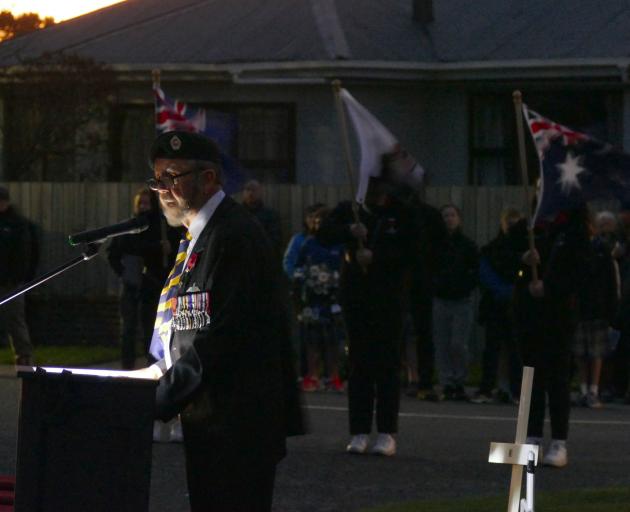 Retired Lt Col Kevin Baff leads proceedings during the Anzac Day Dawn Service in Balclutha today....