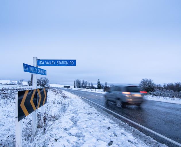  A car travels through the snow-covered Ida Valley in the Maniototo yesterday. Heavy snow fell in...