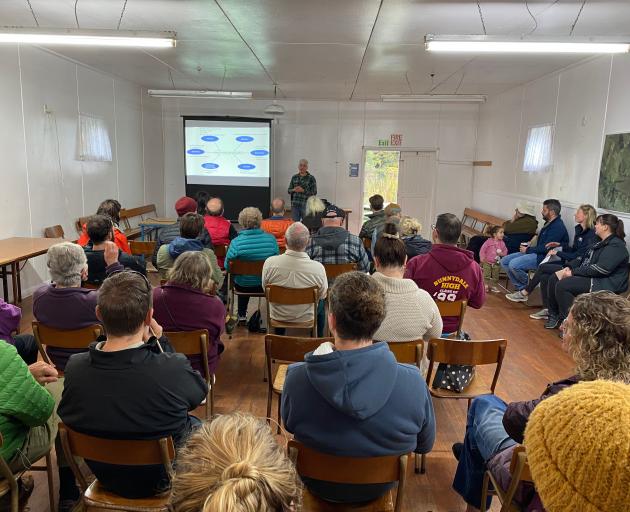 Members of the local Tomahawk community listen as Dr Marc Shallenberg discusses the lagoon...