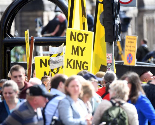 Anti-monarchy protesters outside St Giles' Cathedral in Edinburgh. Photo: Reuters 