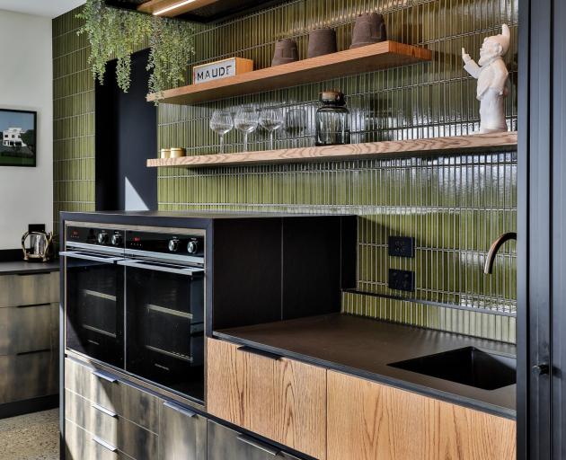 Tiles on top of the ovens serve as a landing spot for hot dishes.