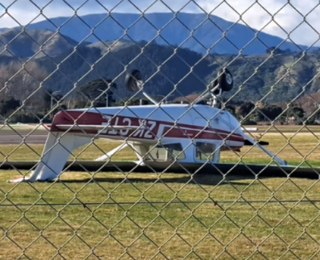 A small two-seater plane at At Kāpiti Airport was flipped upside down by the whirling winds....