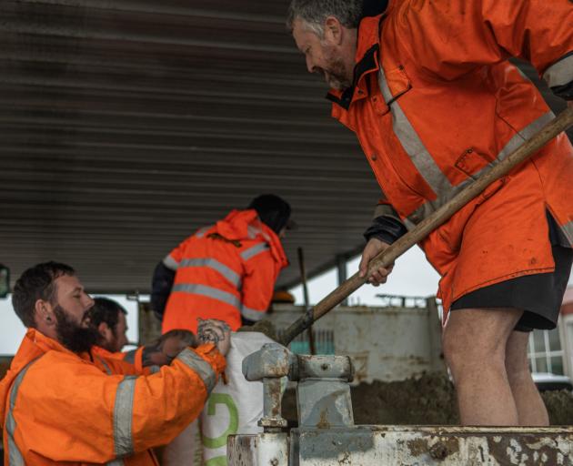 Gore District Council staff and volunteers are filling sandbags as a state of emergency is...