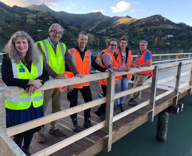 The trustees are excited to finally open the jetty: Louisa Eades (left), David Collins, Nick...