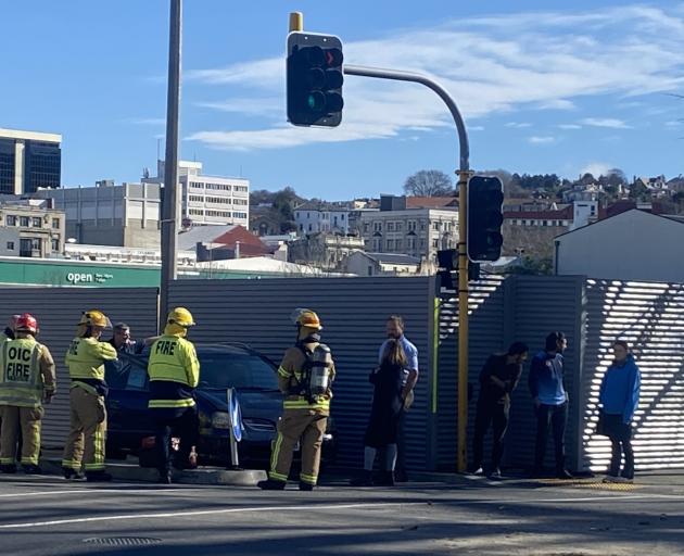 Emergency services at the scene of the crash this afternoon. Photo: Craig Baxter