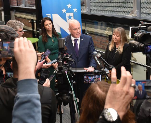 Mr Luxon addresses the media, alongside MPs Erica Stanford and Penny Simmonds